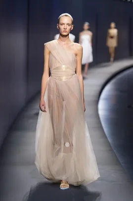 Model in sheer, one-shoulder gown walks runway at Vionnet Spring/Summer 2015 fashion show.