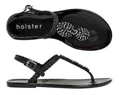 Black braided sandals with beaded details, featuring the brand name "holster" on the footbed.