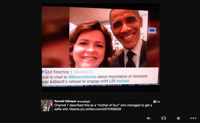 A woman takes a selfie with former President Barack Obama, both smiling at the camera.