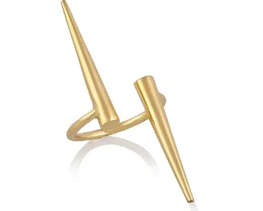 Gold ring with two sharp spikes on a thin band, modern and minimalist design on a white background.