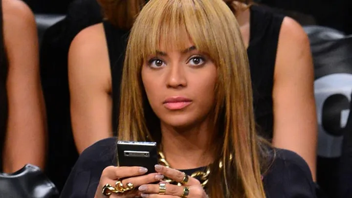 Beyonce with her phone