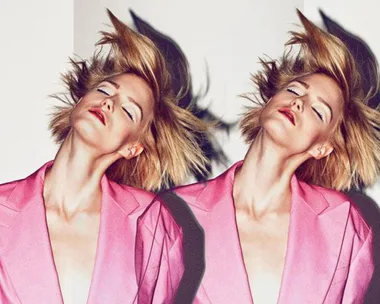 A woman in a bright pink blazer with short blonde hair is shown in a mirrored image, eyes closed and head tilted back.