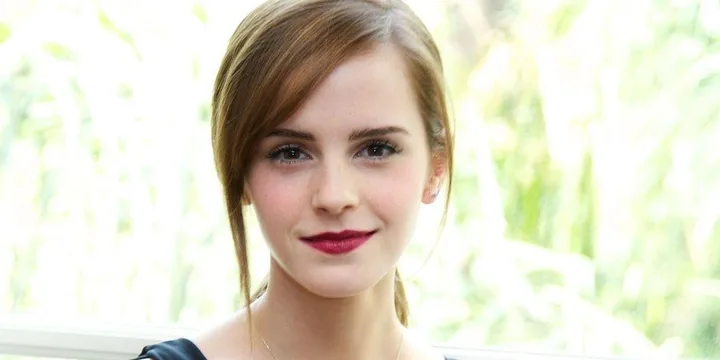 Emma Watson smiling with natural background, likely from the article "emma-watson-is-officially-the-1-woman-in-the-world-3604."