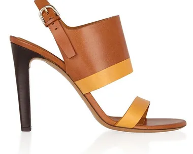 Brown and tan high-heeled leather sandal with ankle strap and buckle.