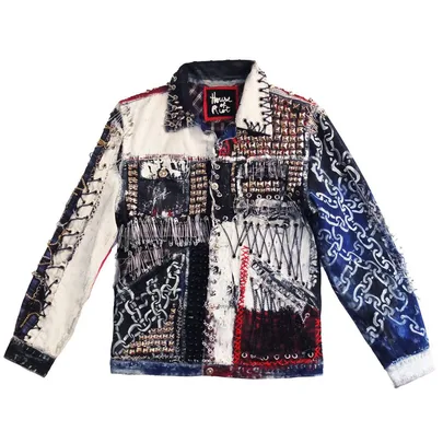 Patchwork denim jacket with blue, red, black, and white design, featuring chains, studs, and stitched details.