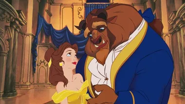 Belle and the Beast share a dance in a grand hall from Disney's "Beauty and the Beast."