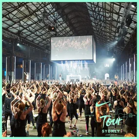 Group workout session at Nike Training Club Tour Sydney with participants exercising indoors.