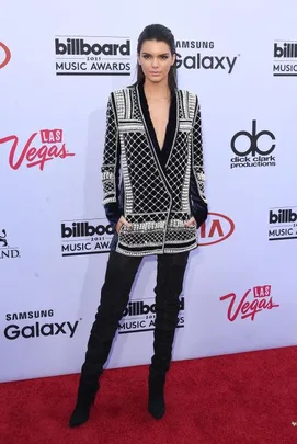 Model in black and silver jacket with leggings on the 2015 Billboard Music Awards red carpet.