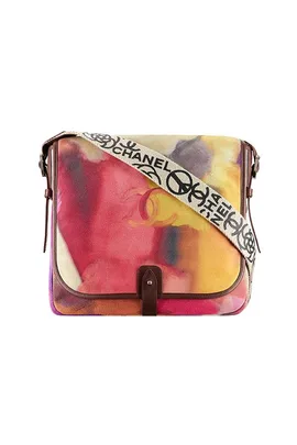 Chanel multicolored messenger bag with a printed strap featuring the Chanel logo and symbols.