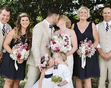 This four year-old really went in for the kiss in wedding photo