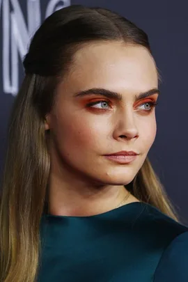 Cara Delevingne wears orange eye shadow