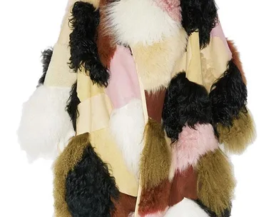 A multicolored patchwork shearling coat with fluffy textures in shades of brown, pink, white, and black.