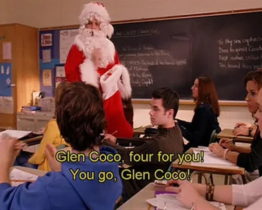 A classroom scene from "Mean Girls" with a person in a Santa costume handing out candy canes, captioned "Glen Coco, four for you!"