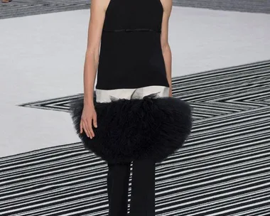 Model in a black top, tulle accent, and pants at Giambattista Valli Haute Couture AW15/16 runway show.