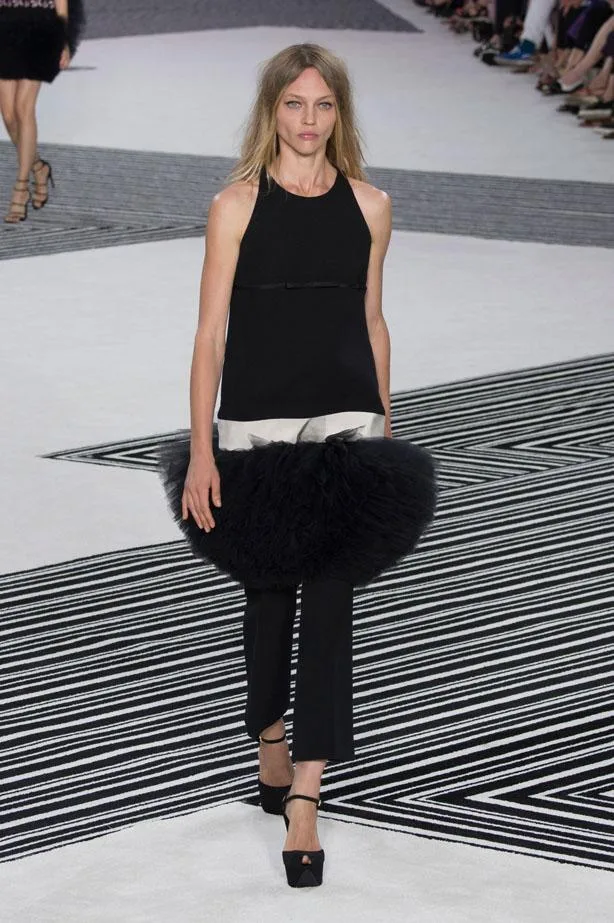 Model in a black top, tulle accent, and pants at Giambattista Valli Haute Couture AW15/16 runway show.