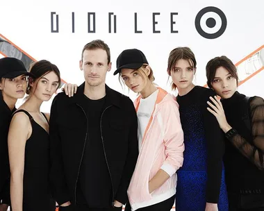 Group photo with Dion Lee and models posing in front of Dion Lee and Target collaboration logo.