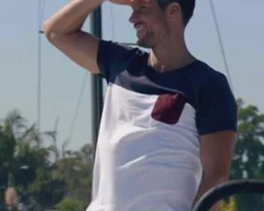 Man shielding eyes while looking into the distance on a boat in "The Bachelor Australia" Season 3, Episode 2.