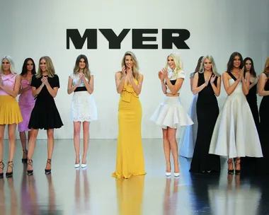 Models in various dresses standing on stage clapping during Myer Spring/Summer Fashion Launch 2015.