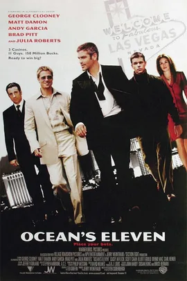 "Poster of Ocean's Eleven with George Clooney, Brad Pitt, Matt Damon in suits, Las Vegas sign in background."