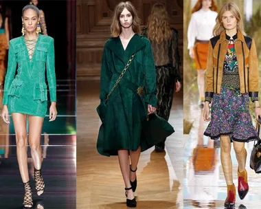 Three models on runway: green lace-up mini dress, green coat with chain belt, and floral skirt with brown jacket.