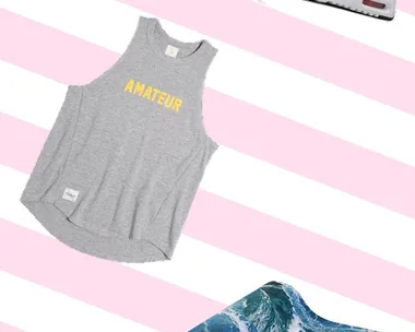 Gray "Amateur" tank top, camo sneakers, and ocean wave yoga mat on pink striped background.