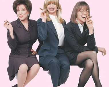 Three women in business suits sit on a bench, smiling and holding cigars against a pastel pink background.