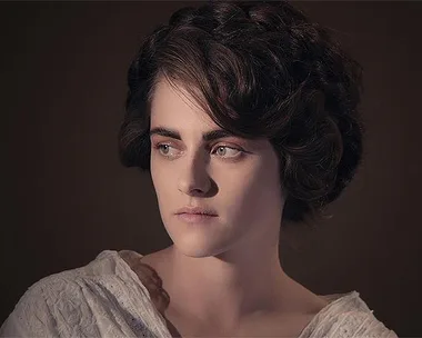 Kristen Stewart as Coco Chanel in a still from the Chanel movie "Once and Forever," looking stern and wearing a period costume.