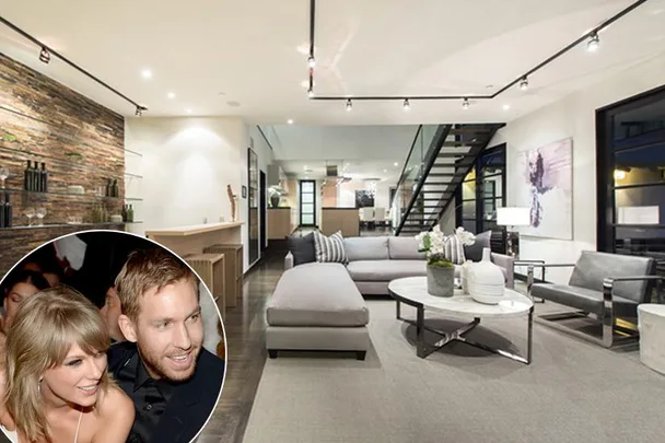 Bright modern living room with sleek furniture and a circular inset of two smiling individuals.