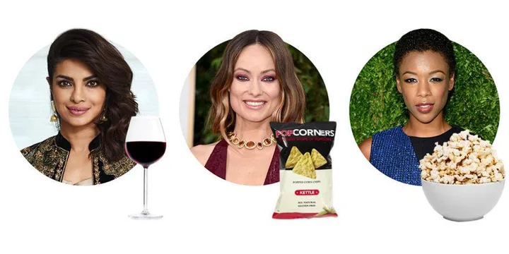 Three women with snacks: a glass of wine, PopCorners chips, and a bowl of popcorn in front of them.