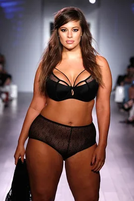 Ashley Graham walks the Addition Elle runway in lingerie.