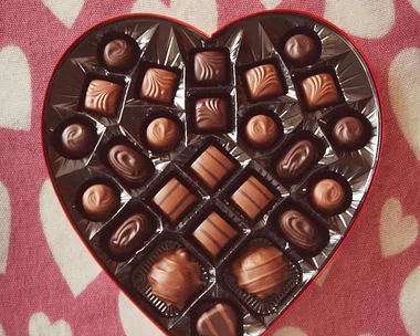 Chocolates in a heart shaped box for Valentine's Day.