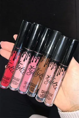 Kylie Jenner holding her Lip Kit by Kylie lipsticks