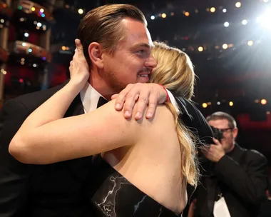 Kate Winslet and Leonardo DiCaprio hugging at the 2016 Oscars.