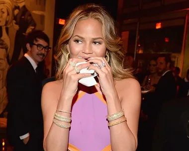 Chrissy Teigen eating.