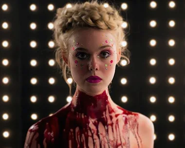 Elle Fanning plays a murderous model alongside Abbey Lee Kershaw, Keanu Reeves, Christina Hendricks, and Jenna Malone in Nicholas Winding Refn's The Neon Demon