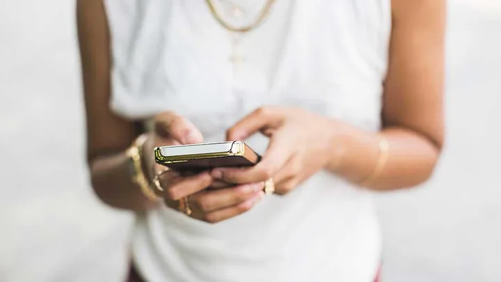 A woman uses an iPhone