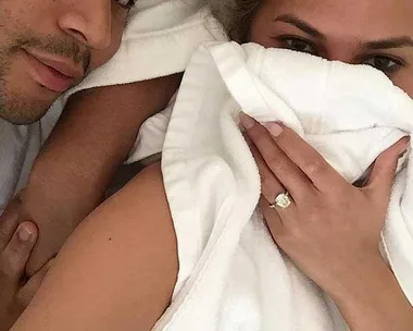 Chrissy Teigen and husband John Legend in bed