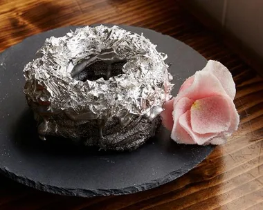 A Brooklyn chef has created a tequila-frosted donut topped with edible platinum and costing almost $200.