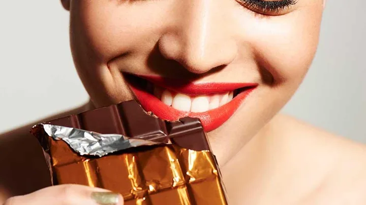 Woman eating chocolate