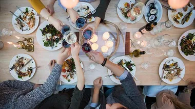 View from above friends toasting wine glasses