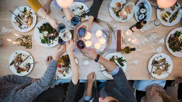 View from above friends toasting wine glasses