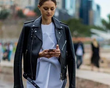 Isabelle Cornish wearing a white Toni Maticevski dress, a black Burberry leather jacket during Mercedes Benz Fashion Week Australia