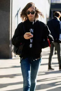 Model using phone on street