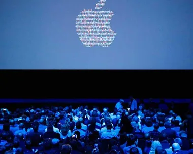 People take their seats ahead of Apple's annual Worldwide Developers Conference presentation at the Bill Graham Civic Auditorium in San Francisco, California, on June 13, 2016.