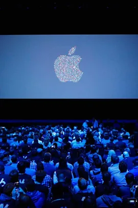 People take their seats ahead of Apple's annual Worldwide Developers Conference presentation at the Bill Graham Civic Auditorium in San Francisco, California, on June 13, 2016.