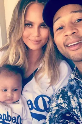 Chrissy Teigen and John Legend with Luna.