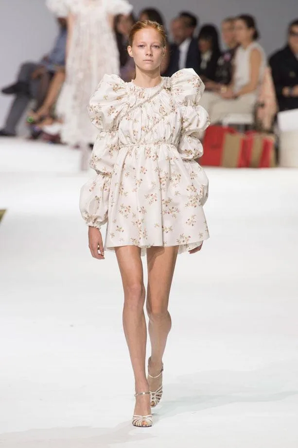 Model in floral white mini dress with puff sleeves walking runway at Giambattista Valli Fall 2016 Haute Couture show.