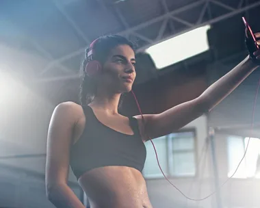 Fitness Model Taking Selfie at Gym