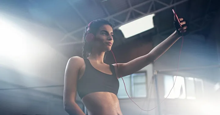 Fitness Model Taking Selfie at Gym