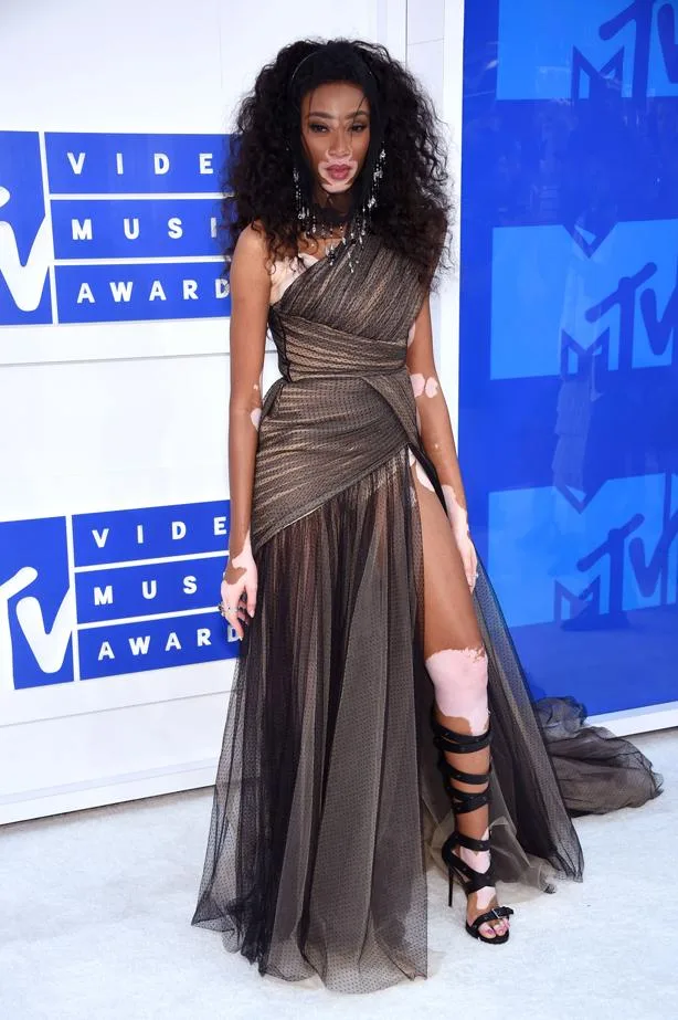 Model in a stylish asymmetric gown with a thigh-high slit at the MTV Video Music Awards.